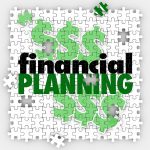 financial planning words on puzzle pieces to illustrate finishing or completing your budget or retirement savings goal or objective